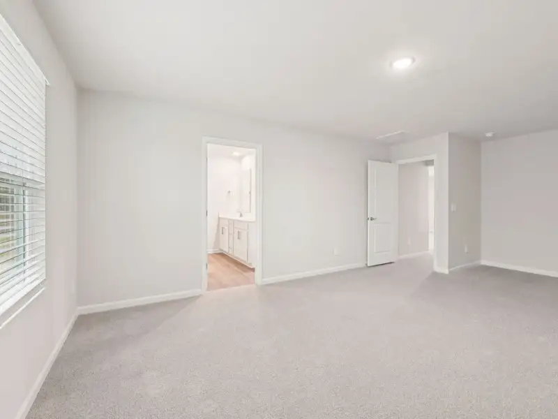 Spacious, unfurnished interior of a new home in Country Lane - Signature Series, Clayton (Image 16).