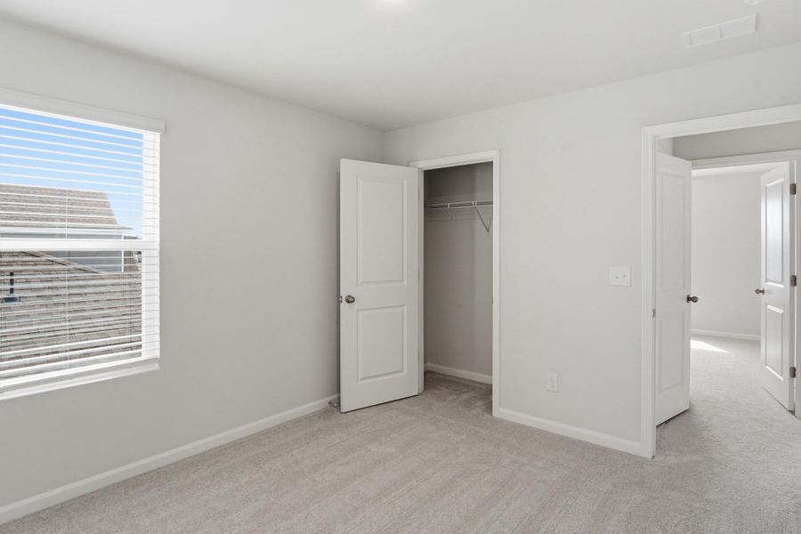 Spacious, unfurnished interior of a new home in Sanctuary Cove at Cane Bay, Summerville (Image 48).