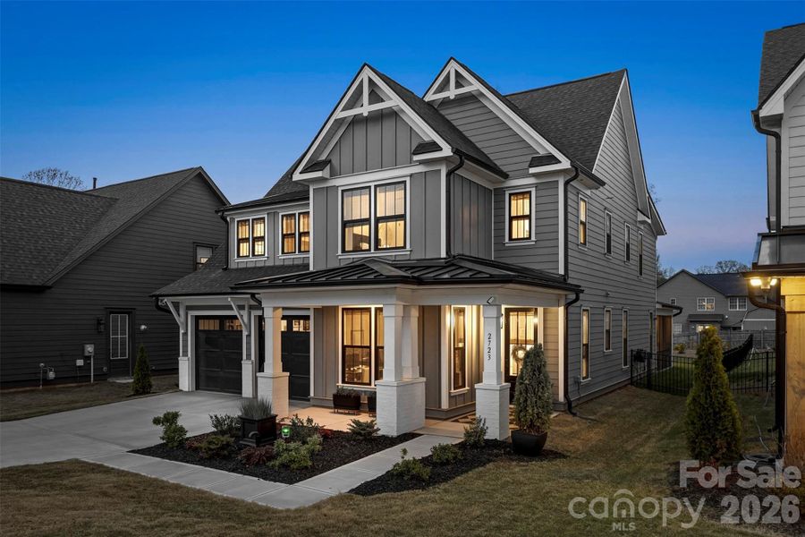 Front exterior of a new home in Matthews Ridge Reserve, Matthews, NC, highlighting curb appeal (Image 1). Front exterior of a new home in Matthews Ridge Reserve, Matthews, NC, highlighting curb appeal (Image 1).