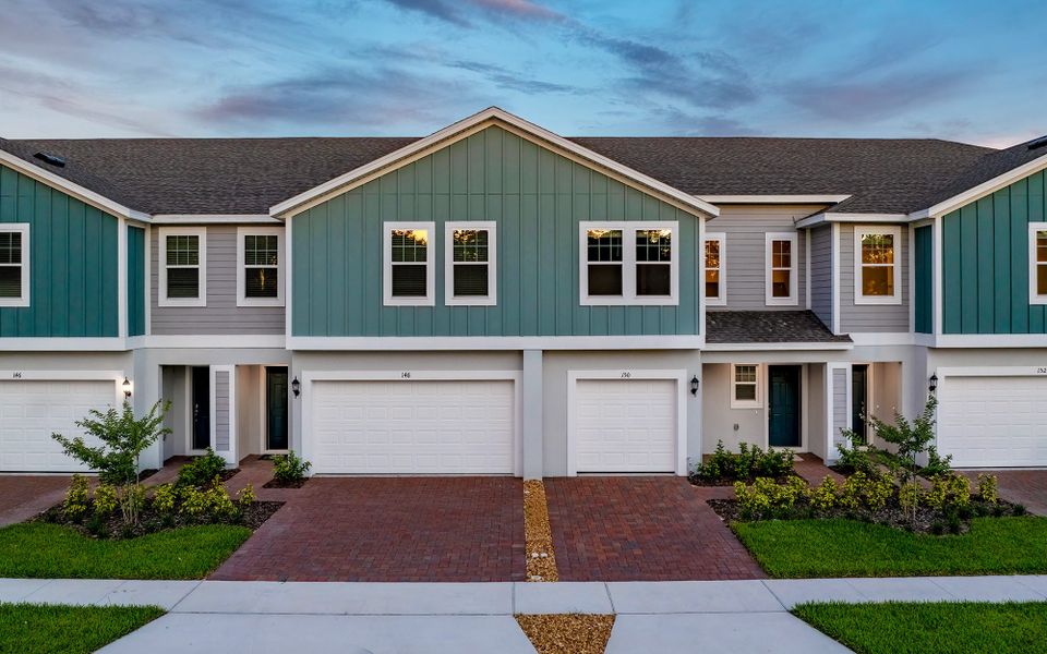 Representative exterior photo of a completed home built from the Douglas by Trinity Family Builders in Blue Springs Reserve Townhomes, Groveland, FL (Image 9).