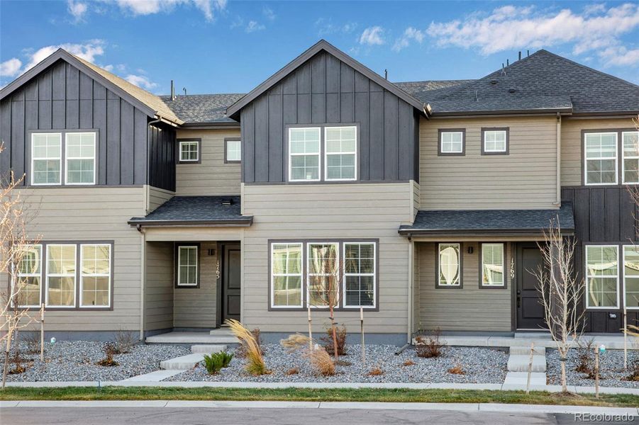 Front exterior of a new home in Westside Crossing Townhomes, Berthoud, CO, highlighting curb appeal (Image 25).