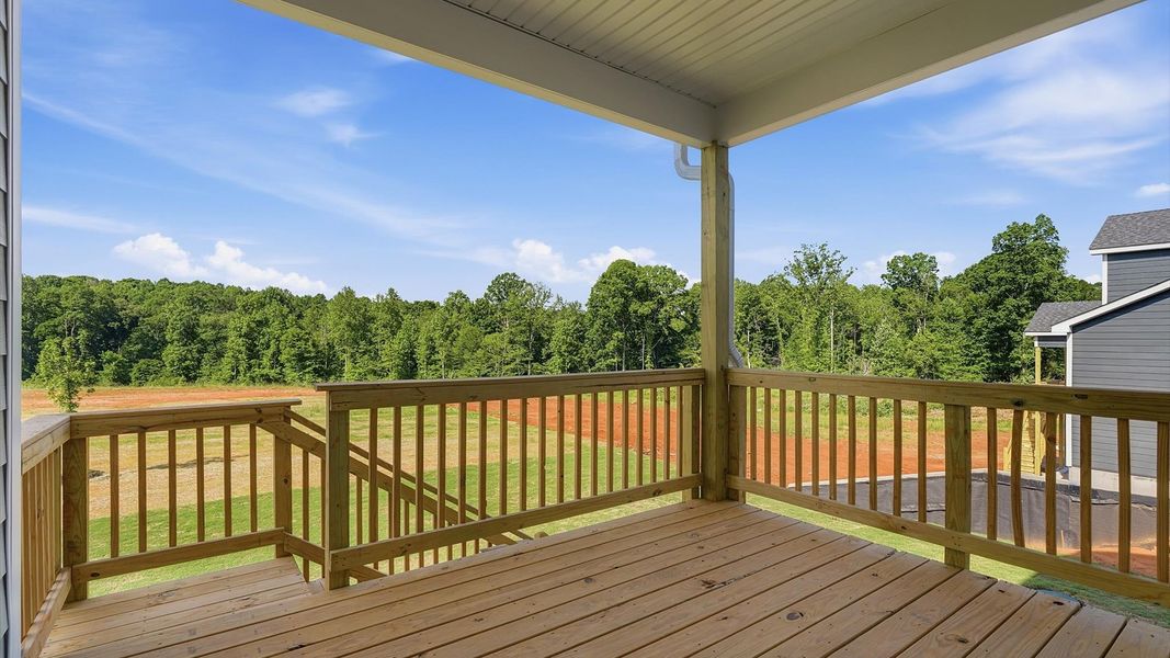 Tasteful rear covered deck provides a peaceful retreat and effortless indoor-outdoor flow at Pinebrook
