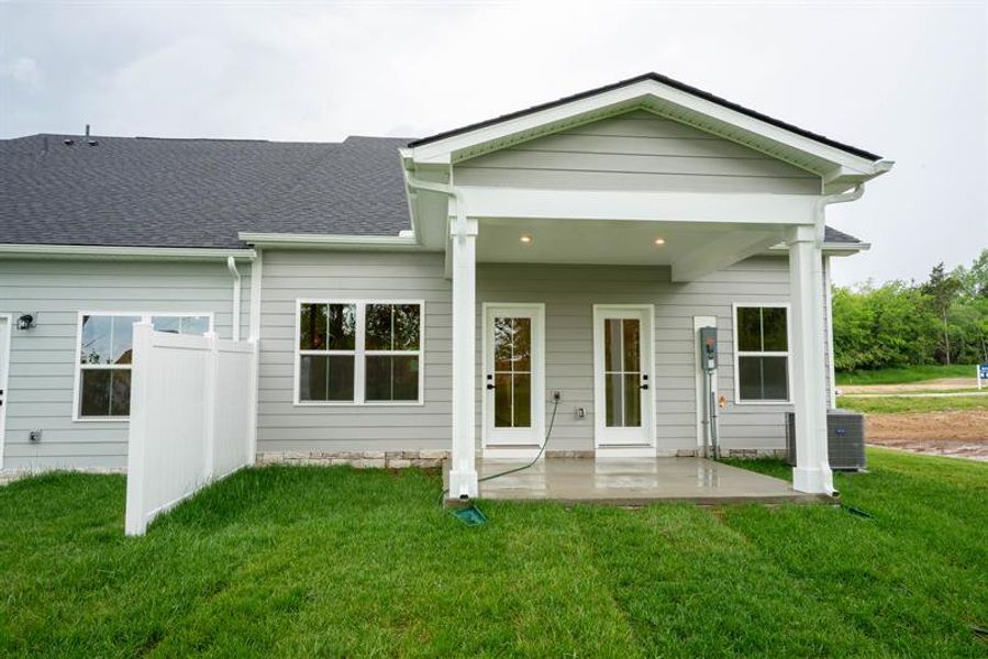 Front exterior of a new home in Spring Branch Townhomes, Smyrna, TN, highlighting curb appeal (Image 2).