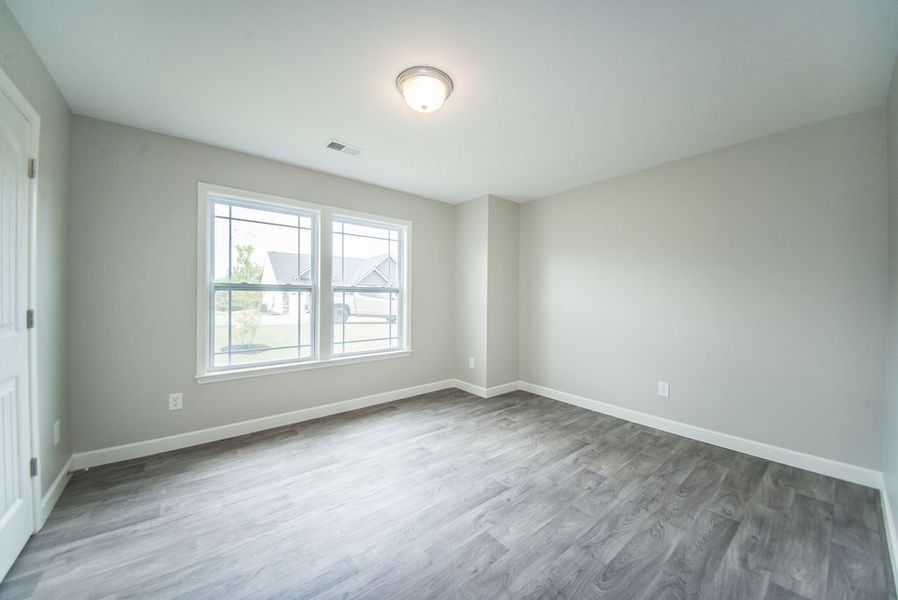 Representative unfurnished interior of a home built from the Beaumont by Enchanted Homes in Guadalupe Heights, Seguin (Image 30).
