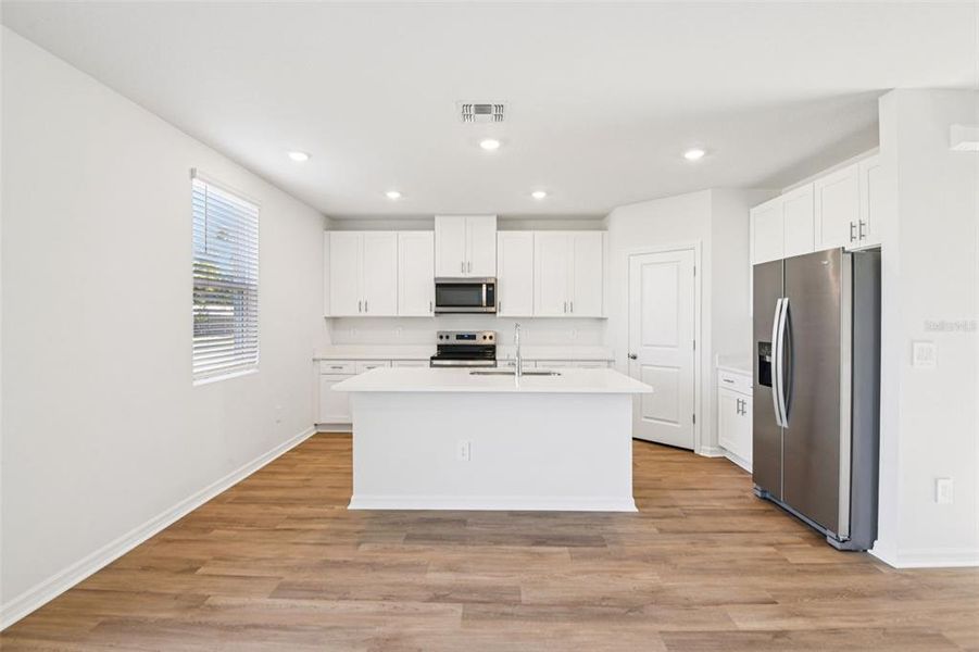 Furnished interior view inside a new home in Hilltop Vistas, Dade City (Image 4).