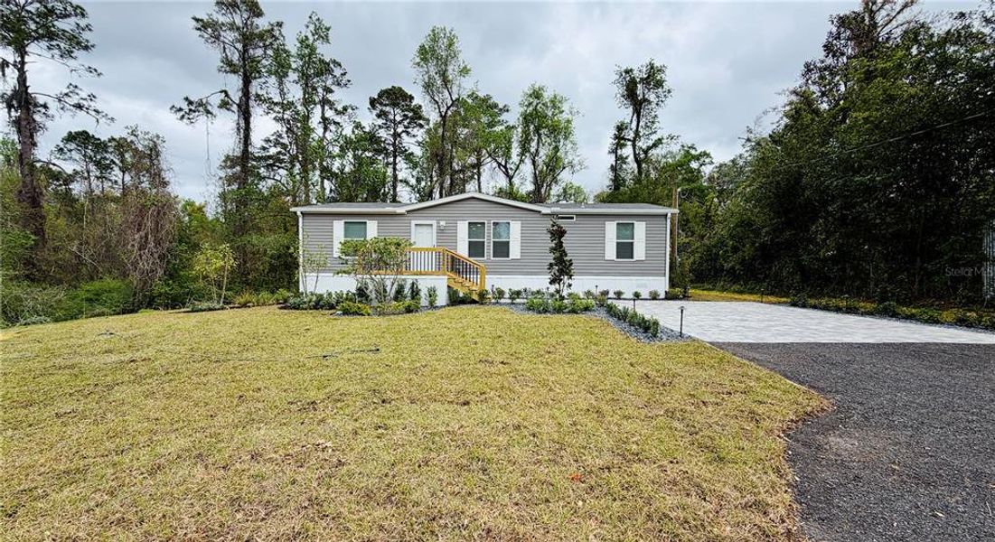 Front exterior of a new home in , White Springs, FL, highlighting curb appeal (Image 32).