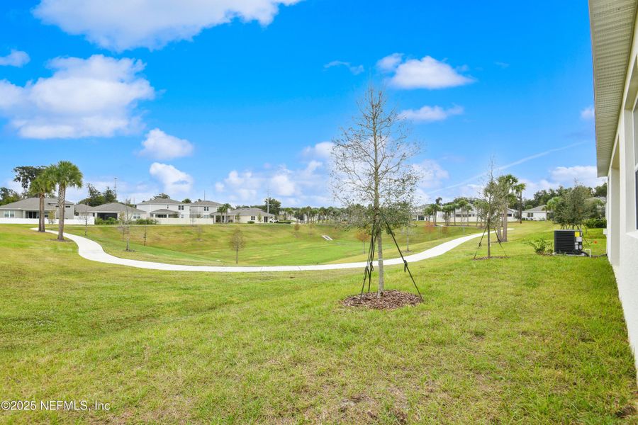 Exterior details and patio area of a home in Seasons at Grandview Gardens, Deland (Image 3).