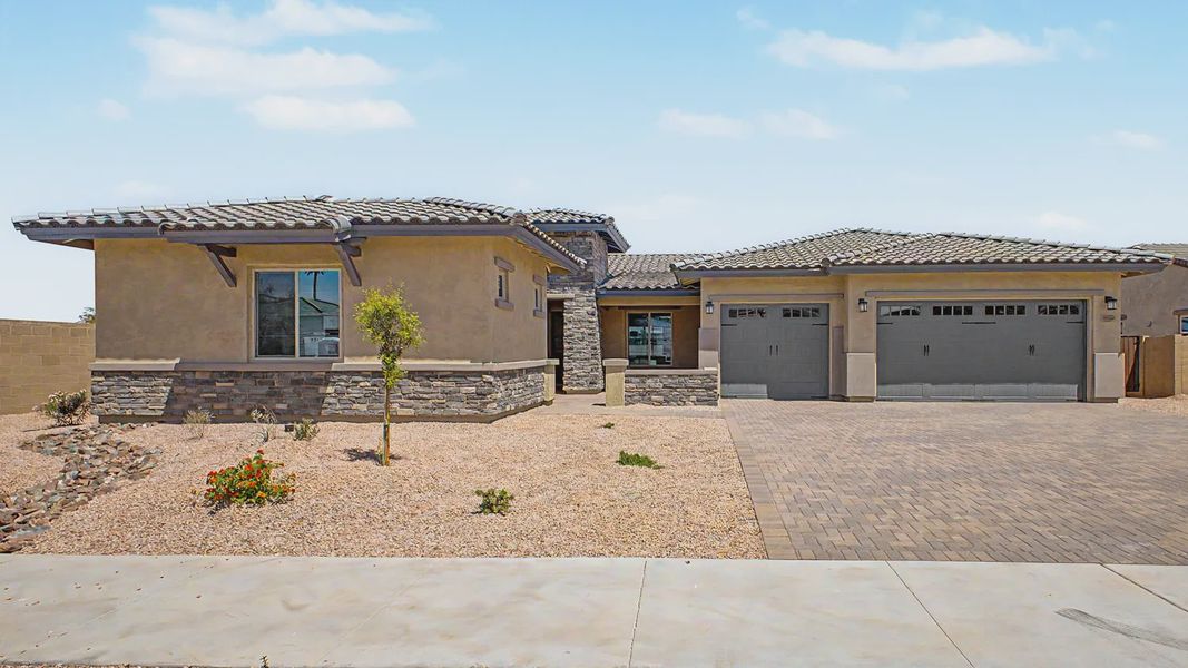 Front exterior of a new home in Bellero Estates, Queen Creek, AZ, highlighting curb appeal (Image 1). Front exterior of a new home in Bellero Estates, Queen Creek, AZ, highlighting curb appeal (Image 1).