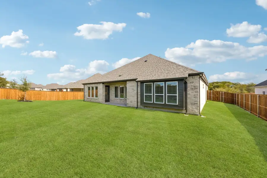 Exterior details and patio area of a home in Rainwater Crossing, Celina (Image 23).