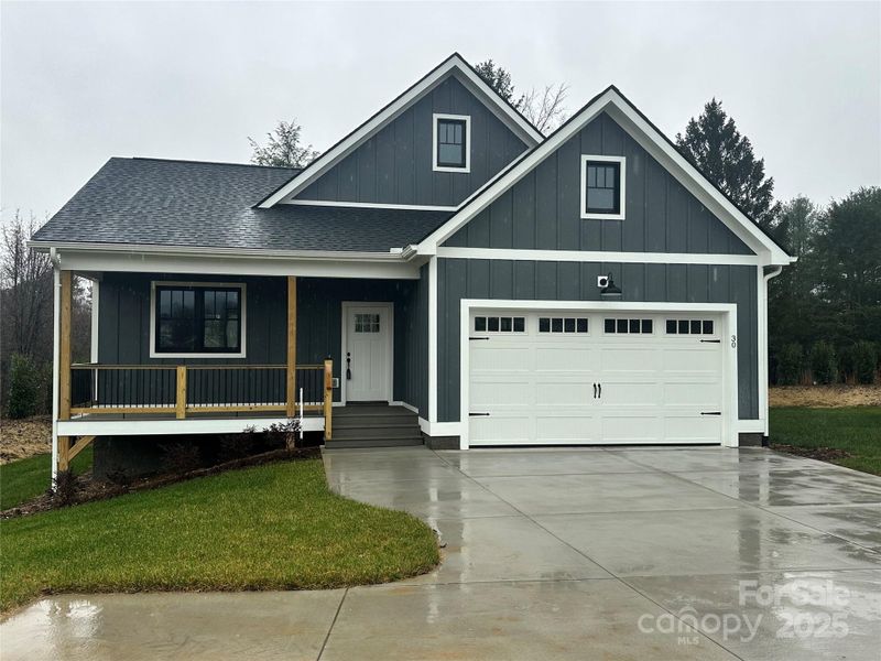 Front exterior of a new home in , Hendersonville, NC, highlighting curb appeal (Image 18).