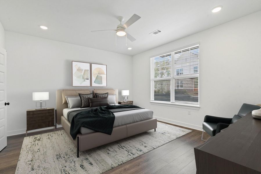 Bright bedroom featuring wood-finish flooring, recessed lighting, and a ceiling fan