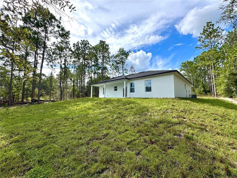 Front exterior of a new home in , Citrus Springs, FL, highlighting curb appeal (Image 1).