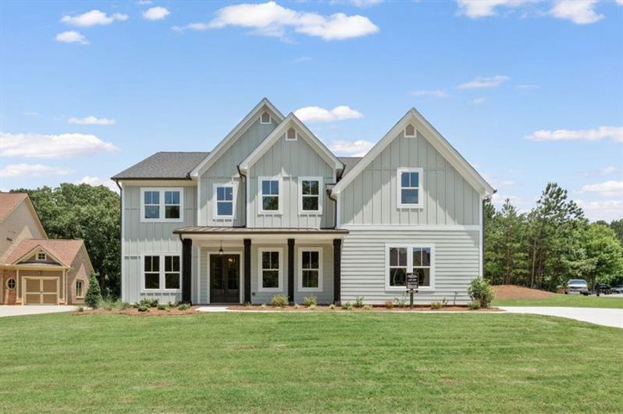 Front exterior of a new home in White Post on Lake Lanier, Gainesville, GA, highlighting curb appeal (Image 1). Front exterior of a new home in White Post on Lake Lanier, Gainesville, GA, highlighting curb appeal (Image 1).