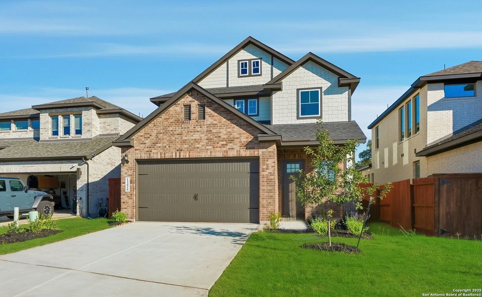 Front exterior of a new home in Stillwater Ranch, San Antonio, TX, highlighting curb appeal (Image 2). Front exterior of a new home in Stillwater Ranch, San Antonio, TX, highlighting curb appeal (Image 2).
