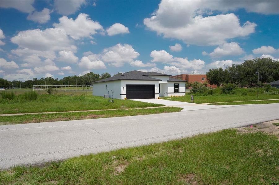 Front exterior of a new home in , Ocala, FL, highlighting curb appeal (Image 25).