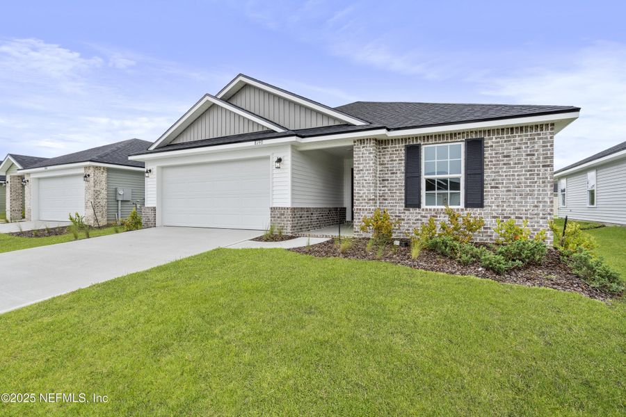 Front exterior of a new home in Summerglen, Jacksonville, FL, highlighting curb appeal (Image 12). Front exterior of a new home in Summerglen, Jacksonville, FL, highlighting curb appeal (Image 12).