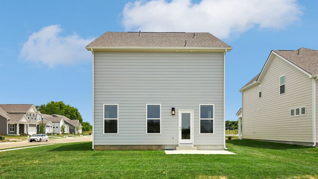 Backyard of home with small back patio