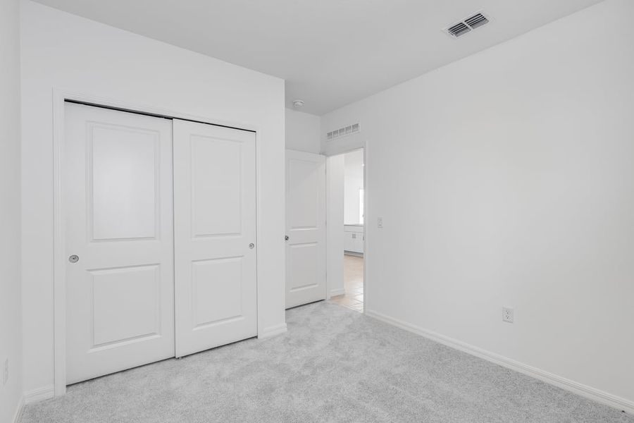 Representative unfurnished interior of a home built from the Spruce by Taylor Morrison in Palm Wind, Hudson (Image 11).