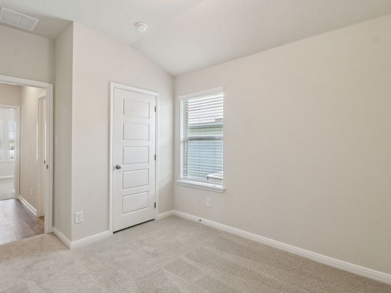 Guest bedroom in the Callaghan floorplan at a Meritage Homes community.