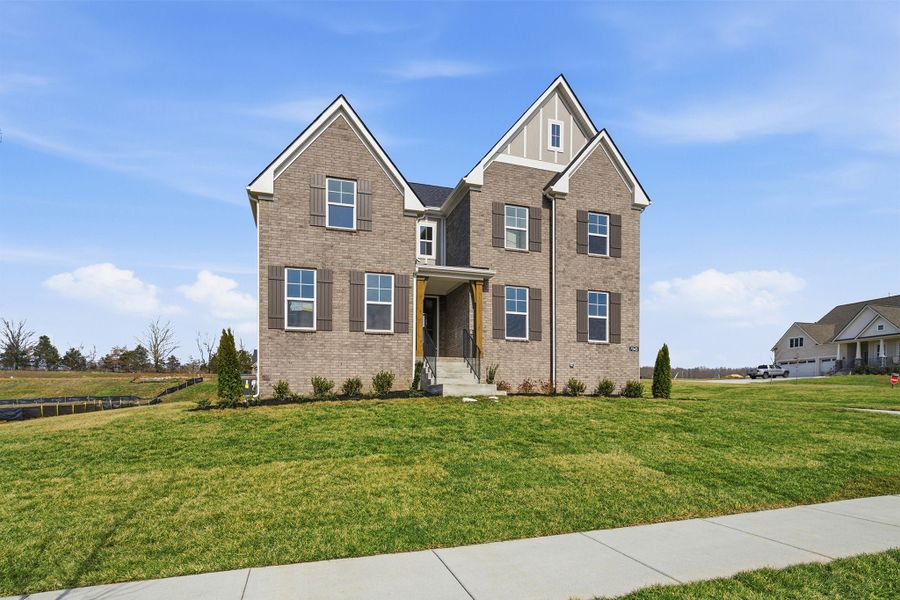 Front exterior of a new home in Aden Woods, Fairview, TN, highlighting curb appeal (Image 27). Front exterior of a new home in Aden Woods, Fairview, TN, highlighting curb appeal (Image 27).