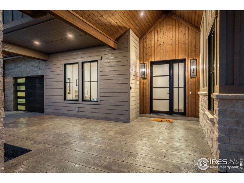 Large Front Porch with tongue and groove detail and stamped concrete