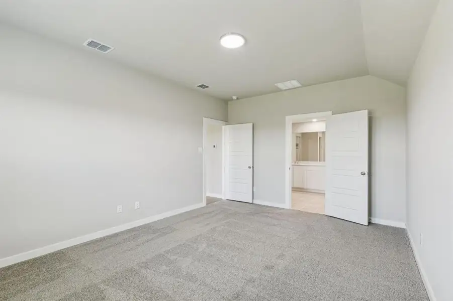 Primary Suite in the Harper home plan by Trophy Signature Homes – REPRESENTATIVE PHOTO