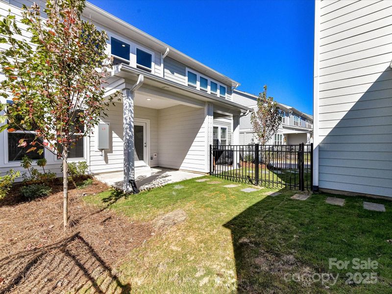 Exterior details and patio area of a home in North Creek Village - Townhomes, Huntersville (Image 4).