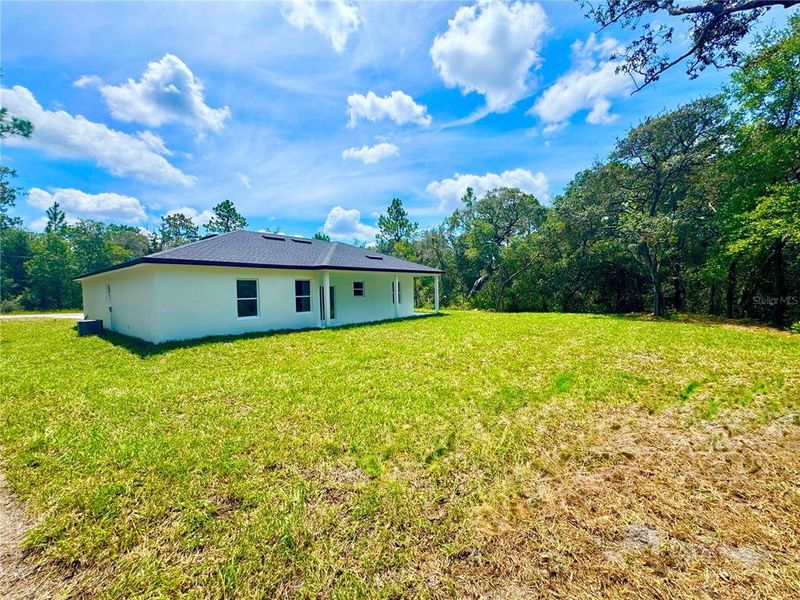 Front exterior of a new home in , Citrus Springs, FL, highlighting curb appeal (Image 2).