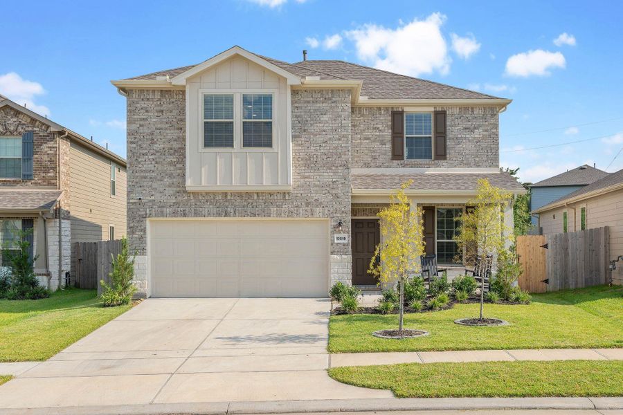 Front exterior of a new home in Myrtle Gardens, Magnolia, TX, highlighting curb appeal (Image 2). Front exterior of a new home in Myrtle Gardens, Magnolia, TX, highlighting curb appeal (Image 2).