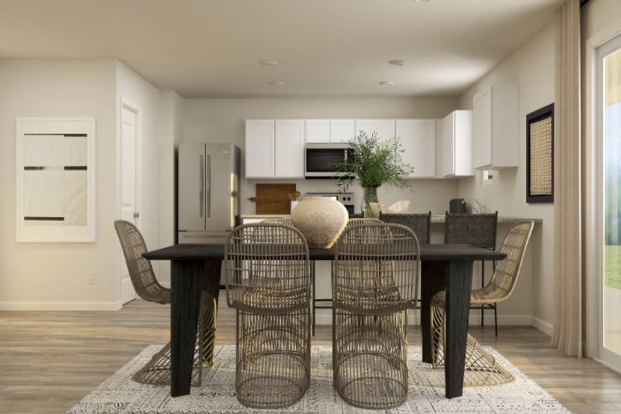 A dining room with a table and chairs.