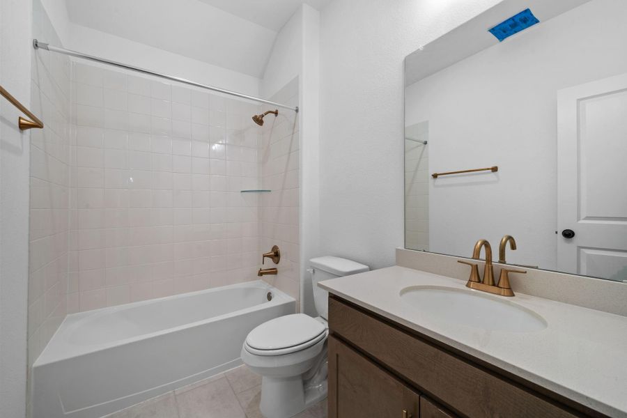 This secondary bath blends modern design with a relaxed, natural feel.