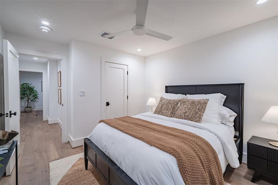 Bedroom featuring ceiling fan and light wood-type flooring