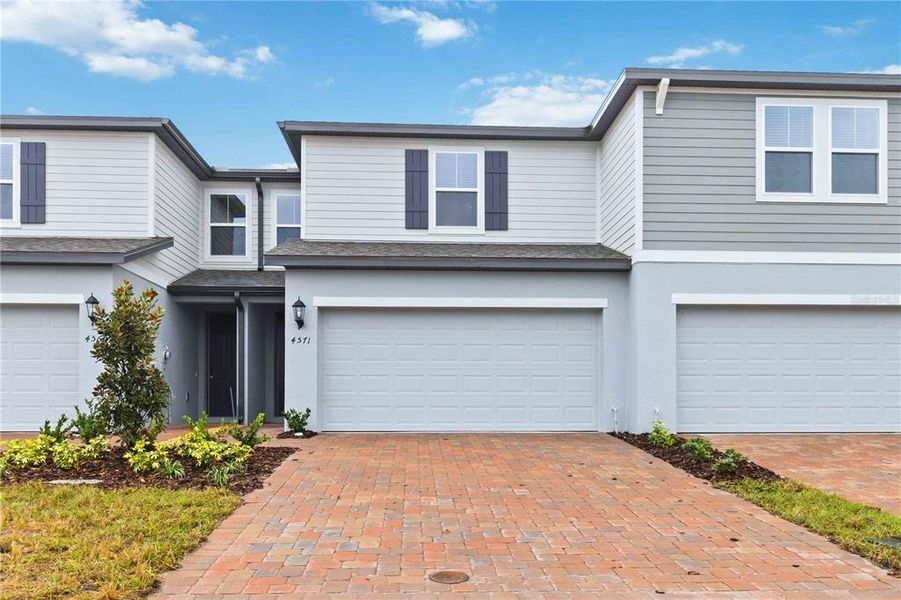 Front exterior of a new home in , St. Cloud, FL, highlighting curb appeal (Image 23).