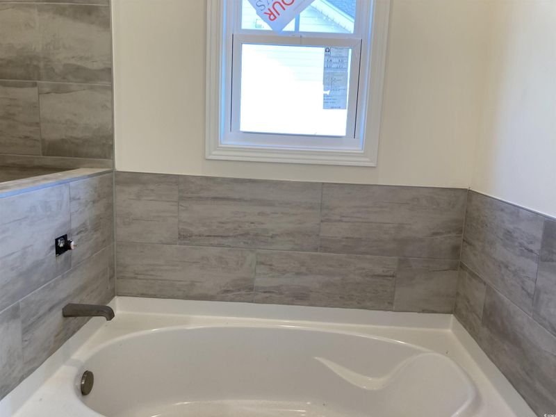 Bathroom featuring a bath