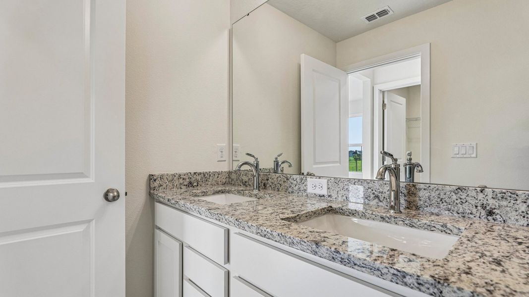 Furnished interior view inside a new home in Cyrene at Harmony, St. Cloud (Image 26).