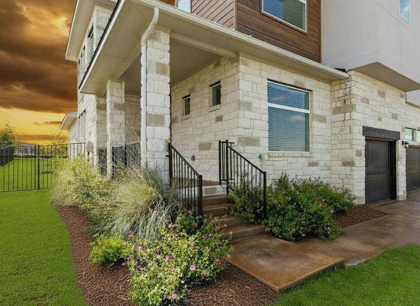Exterior details and patio area of a home in Rough Hollow, Lakeway (Image 2).