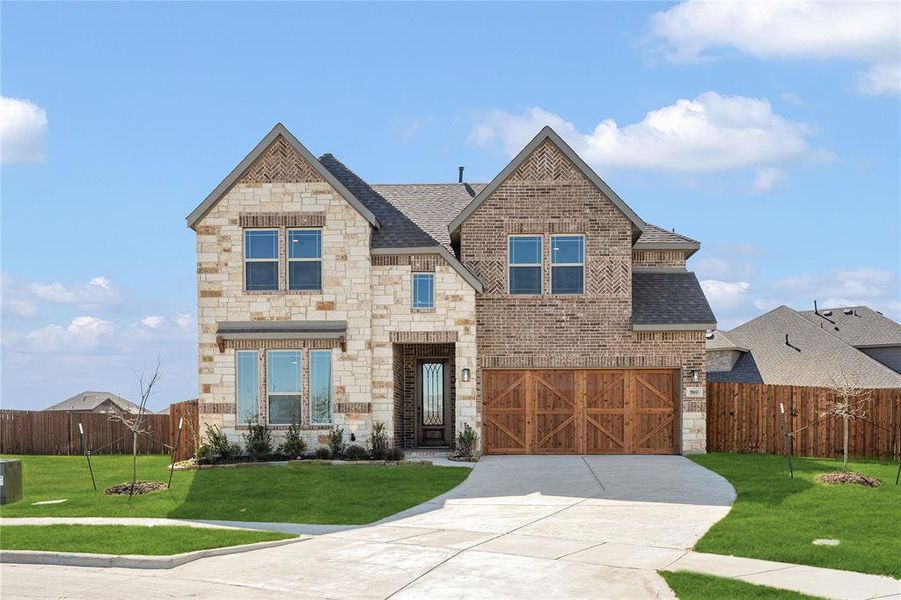 Front exterior of a new home in The Oaks, Red Oak, TX, highlighting curb appeal (Image 2).