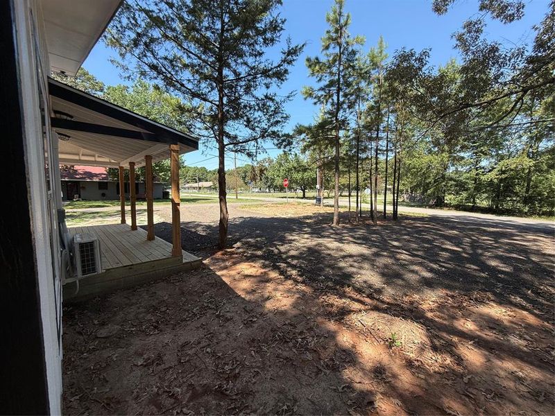 View of yard with a wooden deck