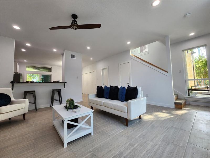 Living room featuring ceiling fan