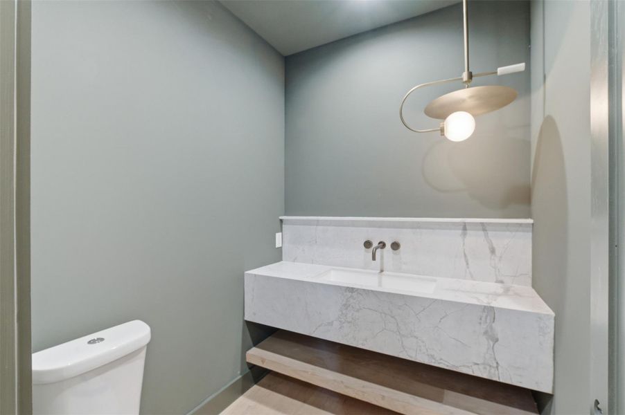 Every detail is thoughtfully designed—including this elegant powder bath that adds style and convenience for guests.