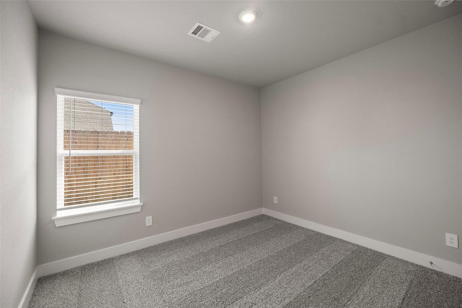 Three spacious secondary bedrooms upstairs, each with large closets and cozy carpet underfoot. Three spacious secondary bedrooms upstairs, each with large closets and cozy carpet underfoot.