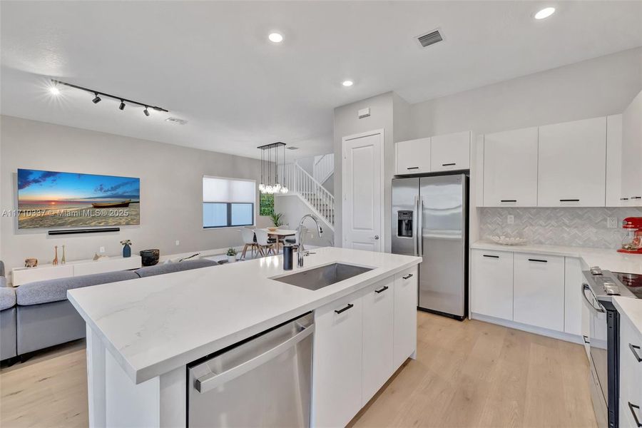 Bright and welcoming kitchen space opens to family room