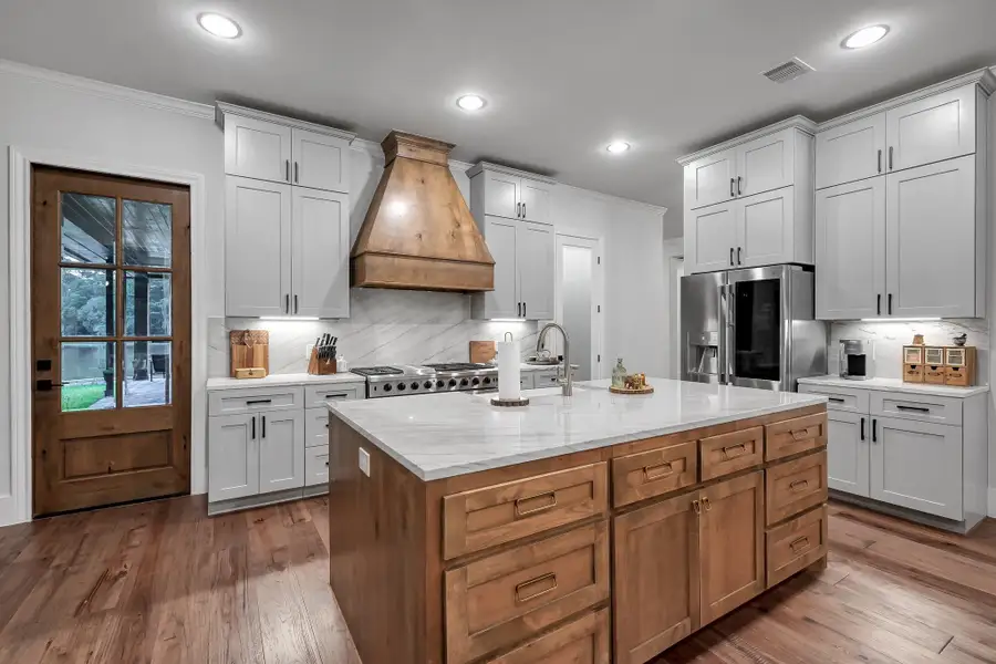 Chef's kitchen wrapped in quartzite and knotty alder.