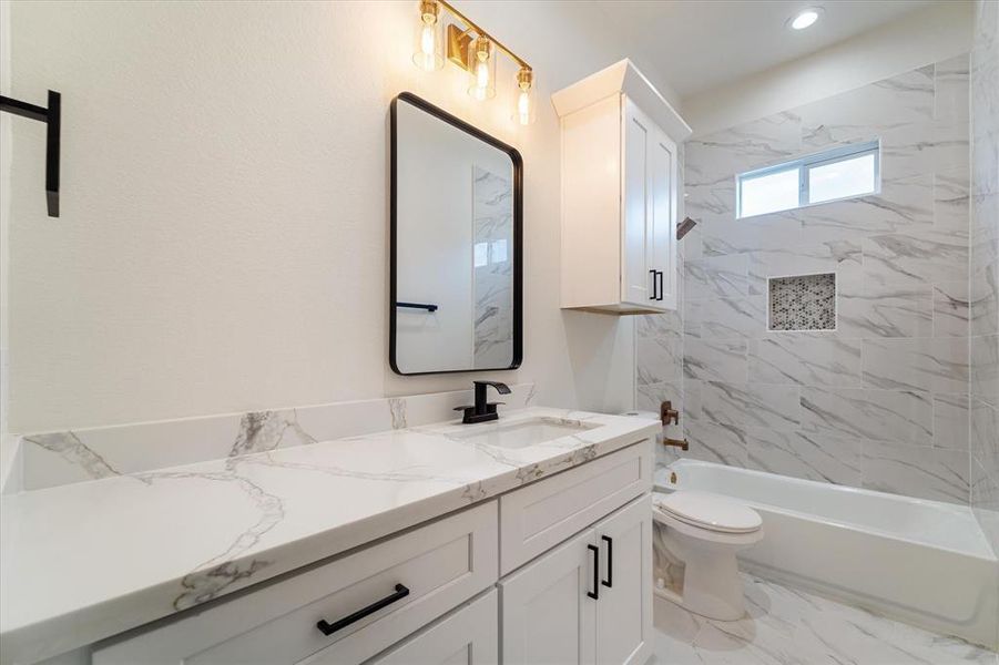 Whether you need a quick shower or a relaxing bath, this second full bathroom suits your every need! With plenty of storage and counter space and all of the fine finishes offered throughout the rest of the home.