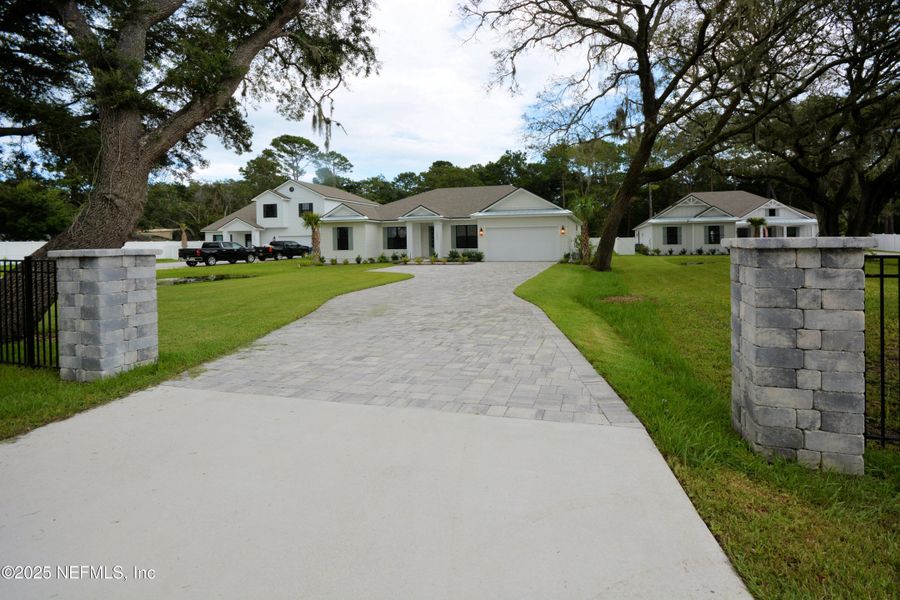 Front exterior of a new home in , Fernandina Beach, FL, highlighting curb appeal (Image 2).