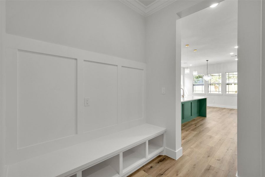 Mudroom off the garage features built-in storage and bench seating Mudroom off the garage features built-in storage and bench seating