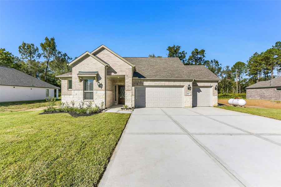 Front exterior of a new home in Encino Estates, Dayton, TX, highlighting curb appeal (Image 19). Front exterior of a new home in Encino Estates, Dayton, TX, highlighting curb appeal (Image 19).