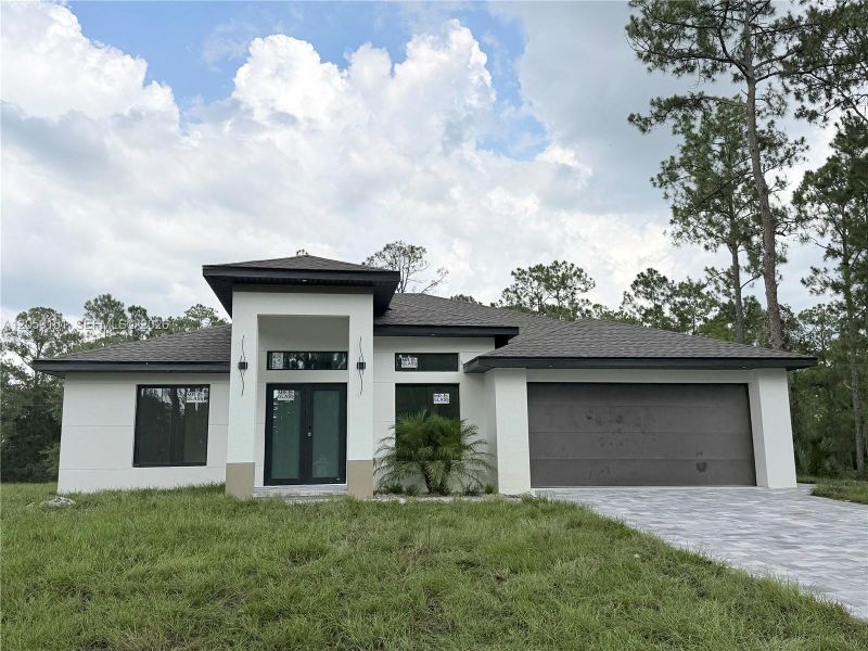 Front exterior of a new home in , Lehigh Acres, FL, highlighting curb appeal (Image 18).
