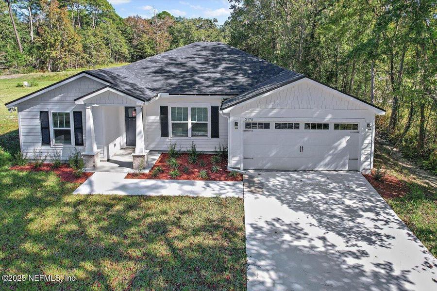 Front exterior of a new home in , Jacksonville, FL, highlighting curb appeal (Image 1).