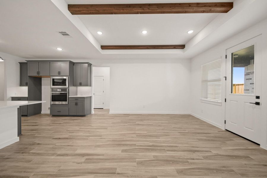 Open great room and dining area (*Photo not of actual home and used for illustration purposes only.)